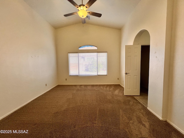 spare room with lofted ceiling, carpet flooring, and ceiling fan