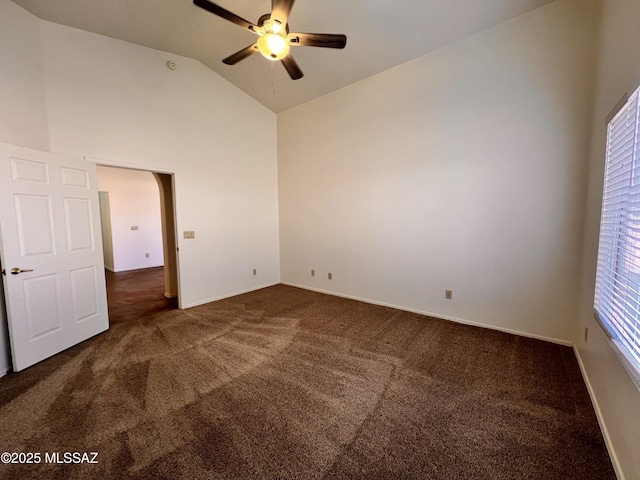 carpeted spare room with high vaulted ceiling and ceiling fan