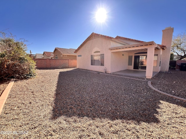 back of property with a patio area