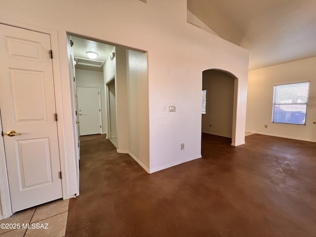 hall featuring dark tile patterned floors