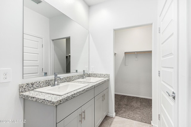 bathroom with vanity and tile patterned flooring