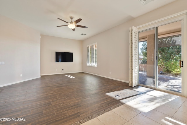 unfurnished living room with ceiling fan and wood-type flooring