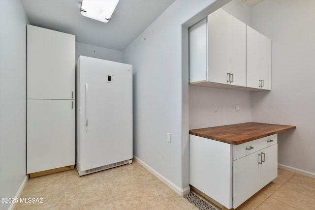 laundry room with light tile patterned flooring