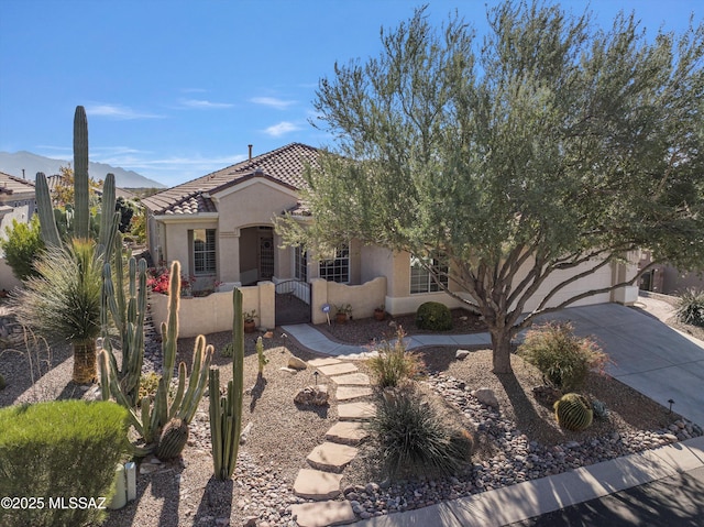 view of front of home featuring a mountain view