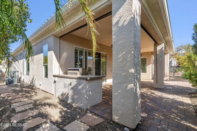 exterior space featuring area for grilling and a patio area