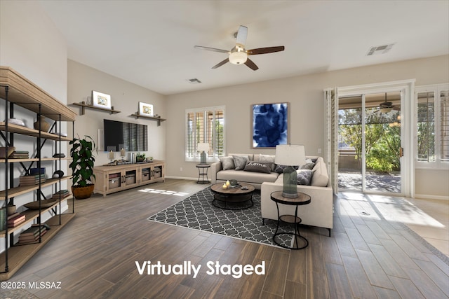 living room with dark hardwood / wood-style floors and ceiling fan