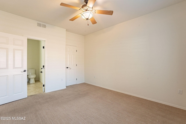 unfurnished room featuring light carpet and ceiling fan