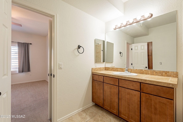 bathroom featuring tile patterned flooring and vanity