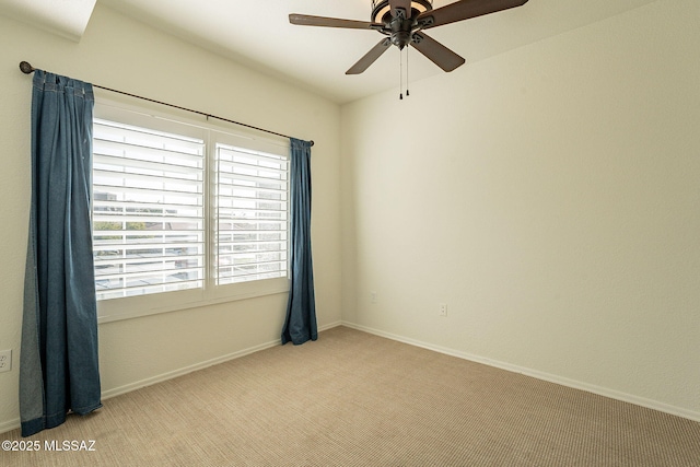 unfurnished room with light carpet and ceiling fan