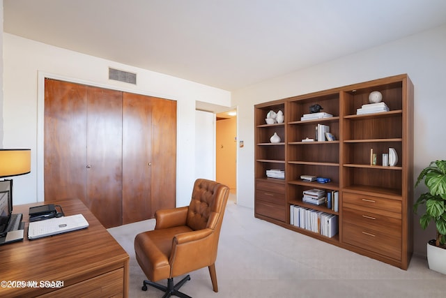 office featuring light carpet and visible vents