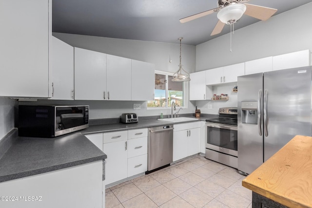 kitchen featuring sink, white cabinets, and appliances with stainless steel finishes