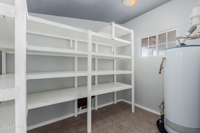 storage room featuring water heater