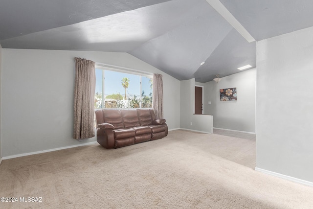 living area featuring vaulted ceiling and light colored carpet