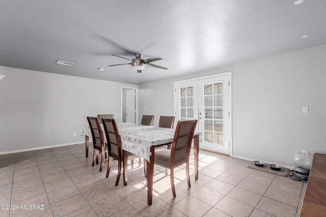 dining space with light tile patterned floors, french doors, and ceiling fan