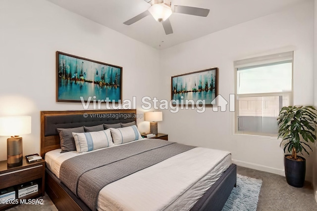 carpeted bedroom featuring ceiling fan and baseboards