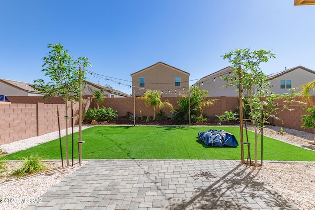 view of yard featuring a fenced backyard and a patio