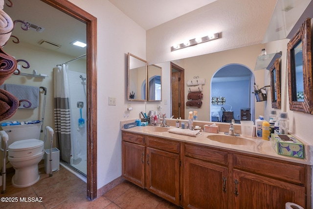 bathroom with tile patterned flooring, vanity, toilet, and a shower with shower curtain