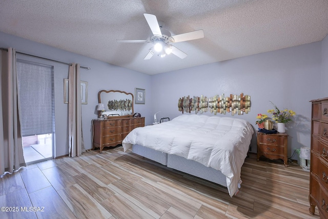 bedroom with ceiling fan, access to exterior, a textured ceiling, and light wood-type flooring