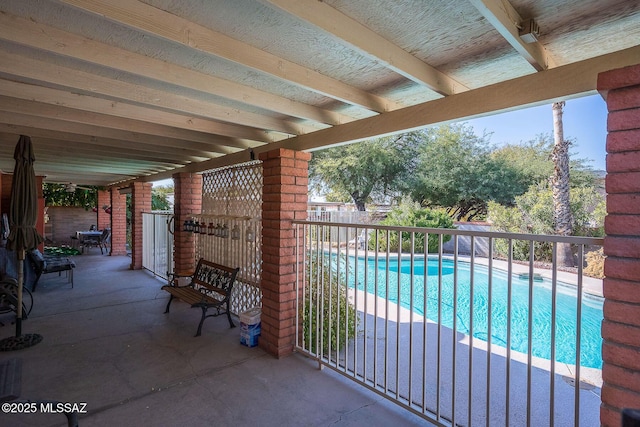 view of swimming pool with a patio area