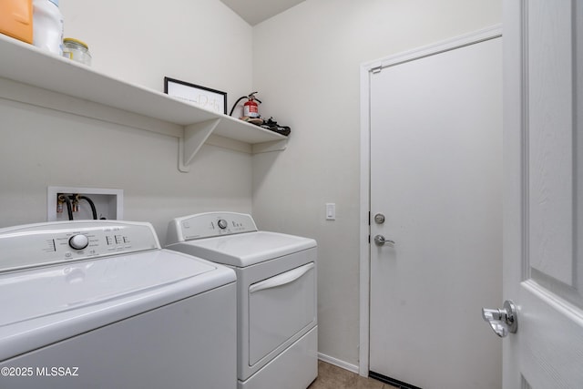 washroom featuring washer and dryer