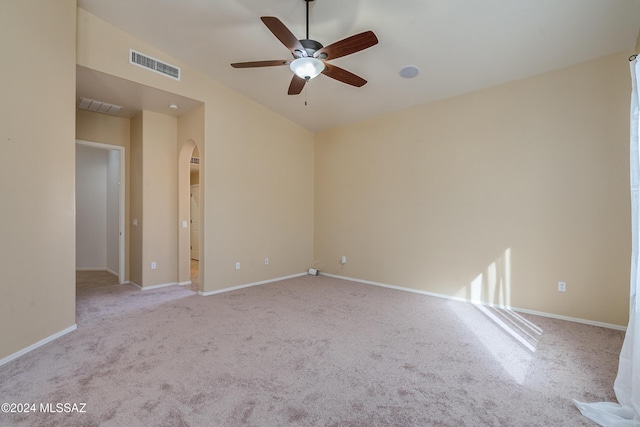 unfurnished room with light carpet, lofted ceiling, and ceiling fan