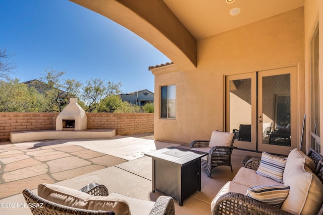 view of patio / terrace featuring an outdoor living space with a fireplace