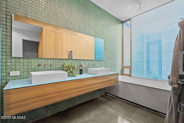 1125 N 13th Ave, Tucson, AZ 85705 - full bathroom with backsplash, a sink, finished concrete flooring, and double vanity