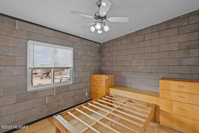 1125 N 13th Ave, Tucson, AZ 85705 - unfurnished bedroom featuring concrete block wall