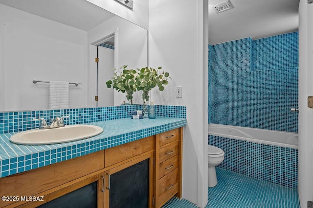 1125 N 13th Ave, Tucson, AZ 85705 - bathroom with toilet, visible vents, tile patterned flooring, tiled shower / bath combo, and vanity