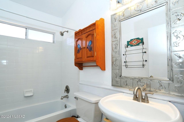 full bathroom with sink, toilet, and tiled shower / bath