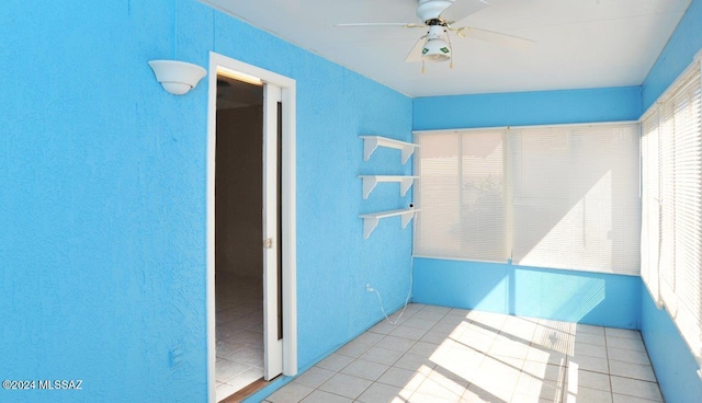 interior space with ceiling fan