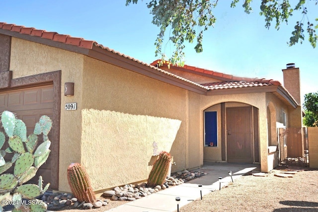 property entrance featuring a garage