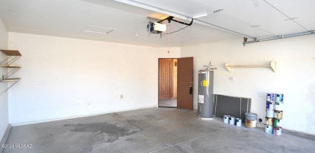 garage with a garage door opener and electric water heater