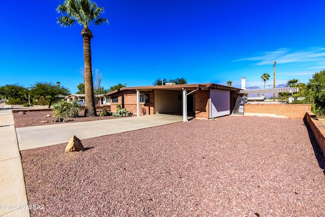 single story home with a carport