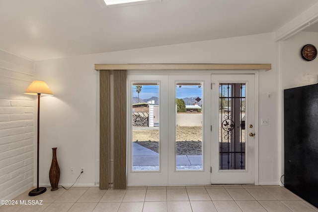 doorway to outside with french doors and light tile patterned floors