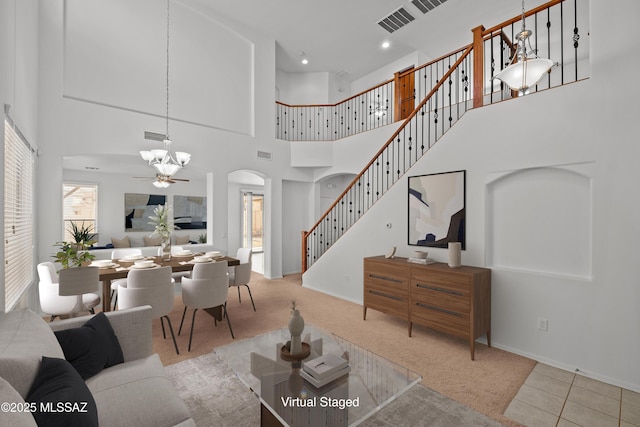 living room featuring ceiling fan and light colored carpet