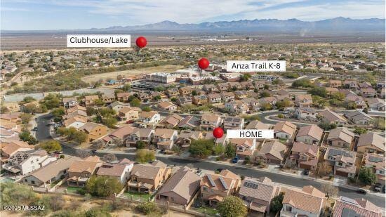 birds eye view of property featuring a mountain view