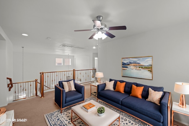 carpeted living room featuring ceiling fan