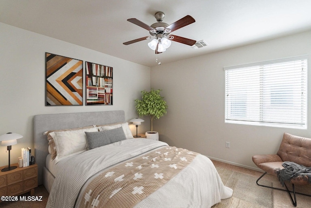 carpeted bedroom featuring ceiling fan