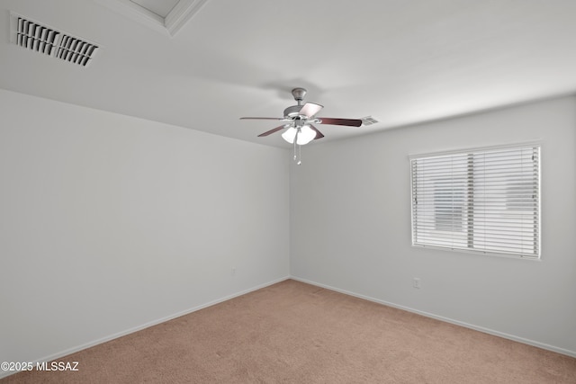 empty room with light colored carpet and ceiling fan