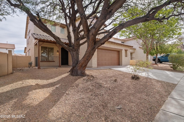 mediterranean / spanish home with a garage