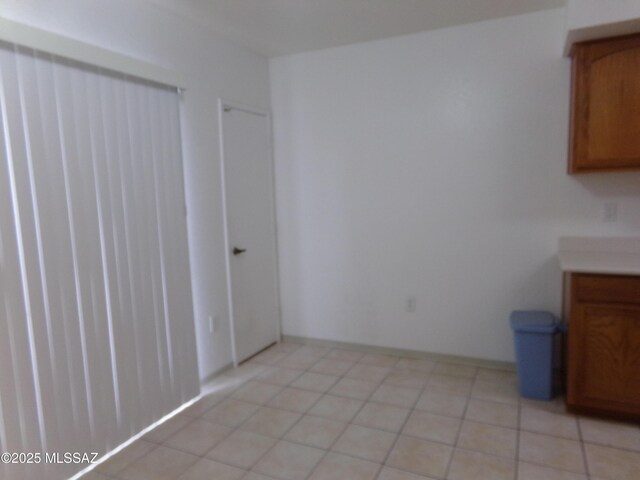 1377 S Desert Meadows Cir, Green Valley, AZ 85614 - unfurnished dining area featuring light tile patterned floors