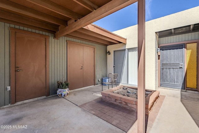 property entrance featuring a patio area