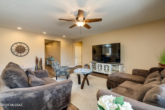 living room featuring hardwood / wood-style flooring and ceiling fan