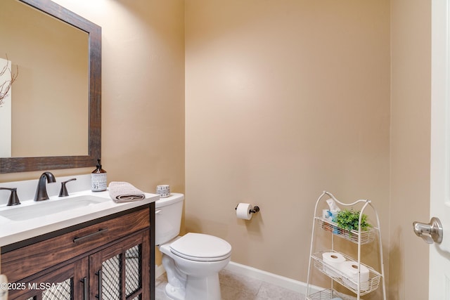 bathroom with tile patterned floors, toilet, and vanity