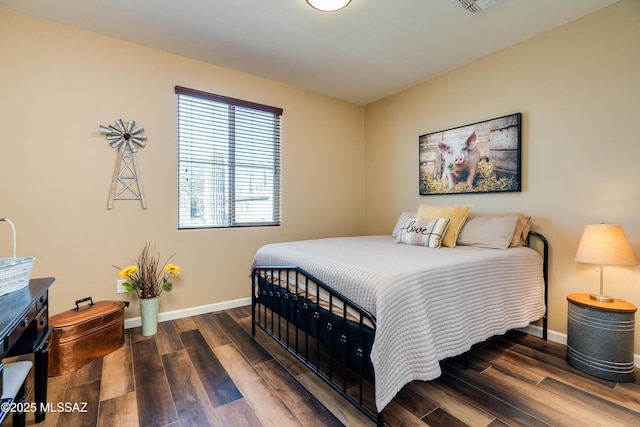 bedroom featuring dark hardwood / wood-style flooring