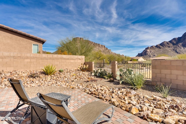 view of patio / terrace with a mountain view