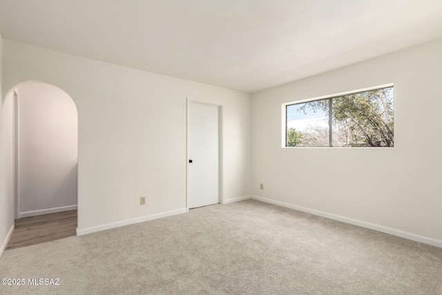 empty room featuring light colored carpet