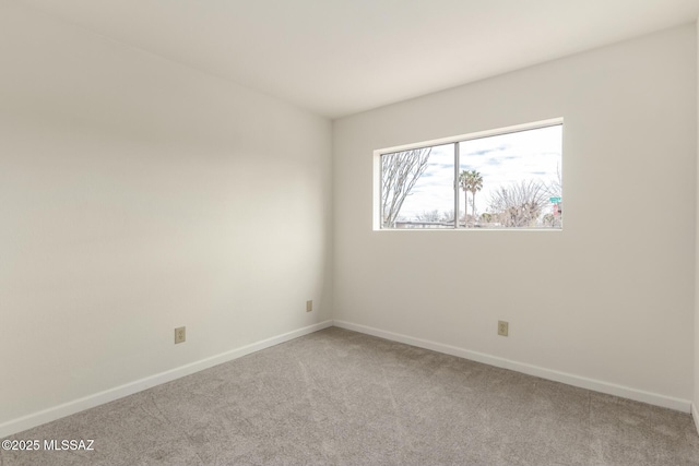 unfurnished room with carpet floors