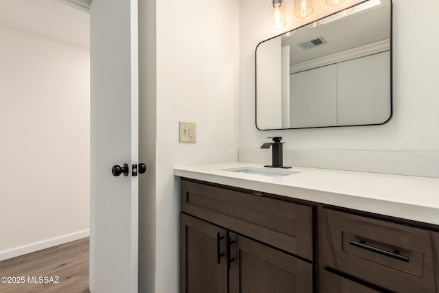 bathroom featuring vanity and hardwood / wood-style flooring